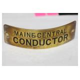 A Vintage Maine Central Conductor Head Badge