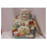 A Ceramic Chinese Buddha with Children