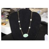 An Art Deco Gold Filled and Sterling Jade Pendant