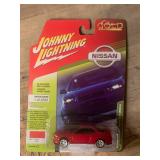 Johnny Lightning 1999 Nissan Skyline GT-R (BNR34) In Active Red
