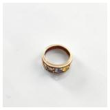 yellow gold cage ring featuring a multi-stone birthstone design.