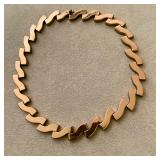 Monet gold necklace features an articulated, zig-zag panel design.