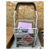 METAL SHOPPING CART FULL OF BOOKS