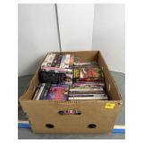 Box of DVDs and VHS Tapes