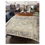 Floral bordered area rug (3' x 5')
