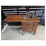 White Rotary Sewing Machine In Wood Cabinet