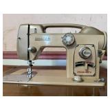 Vintage White Zigzag Sewing Machine in Wood Cabine