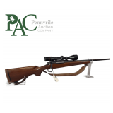 Rifle, Remington 700. 375 H&H Mag with scope.