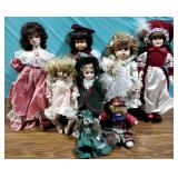 Seven Porcelain Dolls in Period Costume