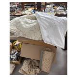 Two Boxes Filled With Linens and Fabric
