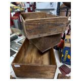 Three Wooden Crates With Branding