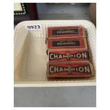 Four Champion Spark Plugs in Boxes