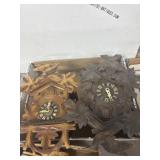 Two Carved Wood Cuckoo Clocks