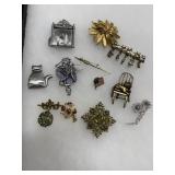 Cat, Floral, and Figural Brooch Lot
