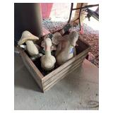 Concrete Garden Statues in Wooden Crib