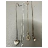 Four Silver-Tone Necklaces
