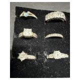 Six Silver Tone Rings with Stones