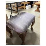 Upholstered Stool with Carved Face Legs
