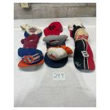 lot of trucker hats sports and NASCAR