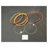 lot of metal and wooden embroidery hoops