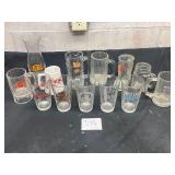 large lot of beer mugs and glasses