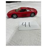 red diecast model Ferrari 348 1:24