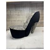 Zebra print high heal shoe chair