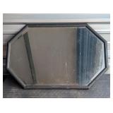 black framed wall mirror