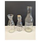 3 carafes, 1 'since 1852', one with eagle