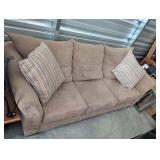 Tan suede-feel microfiber couch with 2 throw...