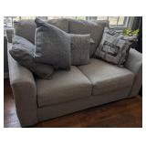 gray loveseat, lightly used