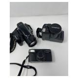 Olympus IS‑2, SuperZoom 300, and Zoom2000 Camera Trio	