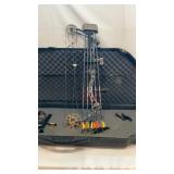 Bear compound bow with accessories and hard case.