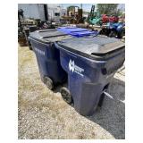 2 plastic trash cans