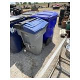 2 plastic trash cans