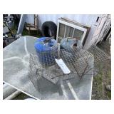 2 kerosine cans and animal trap