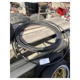 roll of plastic tube and 3 pvc pipe