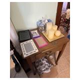 A lot of candles and picture frames and one