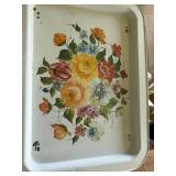 This item is a vintage metal serving tray or TV