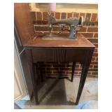 In cabinet, antique sewing machine