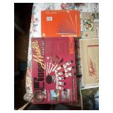 There are boxes of paint and thereï¿½s a box of