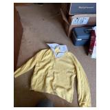 A tote of womenï¿½s sweaters