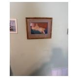 A picture of a lot on the wall for pictures