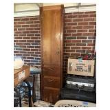 Tall shelf with two doors and two drawers