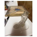 The object in the image is a vintage clear glass