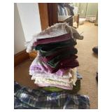 A pair of bed pants and 20 towels with a wicker