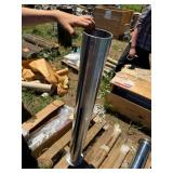 Stainless steel cylinder with metal flange at base
