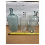 Three vintage glass bottles