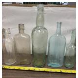 Lot of five vintage glass bottles