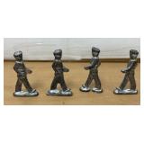 Four metal soldiers vintage